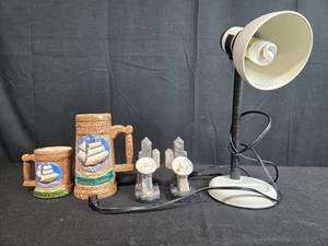 lot 58 image: Mixed Decor Lot with Mariners Inn Mugs, Stone Bookends, and Desk Lamp