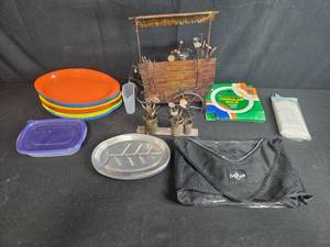 lot 107 image: Mixed Household Lot with Metal Flower Cart, Plastic Plates, Drop Cloth, Bulb, and Storage Items