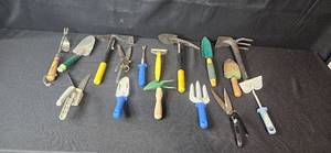 lot 115 image: Assorted Garden Hand Tools Collection including Trowels, Forks, and Shears