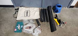 lot 125 image: Toro Leaf Blower Parts and Accessories Bundle with Bag