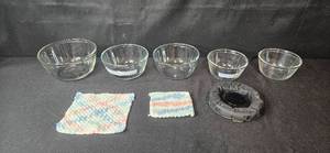 lot 139 image: Set of Glass Mixing Bowls with Woven Pot Holders and Weighted Support Pad