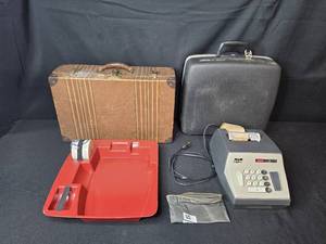 lot 174 image: SCM M.C.R. 890 Electric Adding Machine with Accessories and Vintage Cases