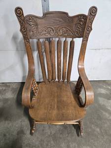 lot 217 image: Antique Wooden Rocking Chair with Ornate Carved Back and Arms