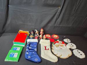 lot 228 image: Holiday Decor and Party Supplies Lot with Stockings, Ornaments, Napkins, and Tablecovers