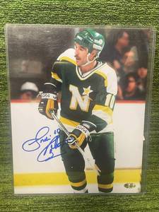 lot 184 image: Vintage North Stars Autographed 8x10 Photo by Gordie Roberts (2 Stanley Cups, Elk River & Maple Grove Coach)