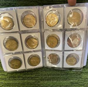 lot 284 image: Pinnacle Mint lot of Brass Coins in Coin Album multiple sports possibly included