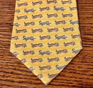 lot 48T image: Hermes 100% Silk Yellow Tie with Tigers and Monkeys Motif
