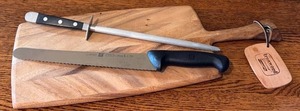 lot 90D image: K - Ironwood Gourmet Cutting Board, Viking Honing Steel, and Zwilling Bread Knife Set