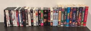 lot 732R image: LL  - Collection of DVDs and VHS Tapes Including Disney Classics and Popular Films