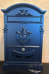 lot 833C image: LR - Blue Wall-Mount Locking Mailbox with Crest Design and Keys, 18 Inch Height