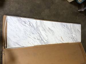 lot 59 image: Hampton Bay 8 ft Straight Laminate Countertop Kit Included in Gloss Calcutta Marble    Customer Returns See Pictures