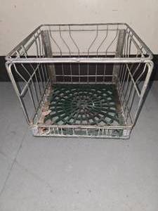 lot 29 image: vintage milk crate with green bottom