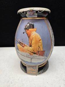 lot 71 image: Miller Norman Rockwell, stein, broken handle