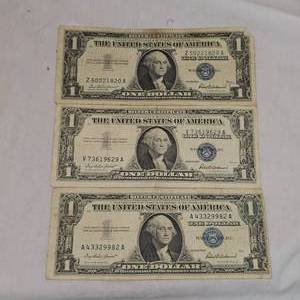 lot 62 image: (3)1957 Series $1 Silver Certificate