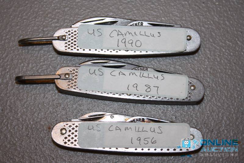 lot 109 image: Lot of (3) U.S. Marine Corp. Camillus Key-Chain Bottle OpenerUtility Tool 1987, 1956, 1990.