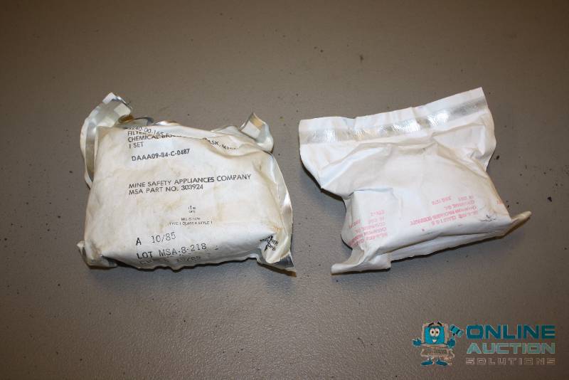lot 24 image: Lot of (2) Gas Mask Filter Element Sets Chemical-Biological Mask M13A2 DAAA09-84-C-0487.