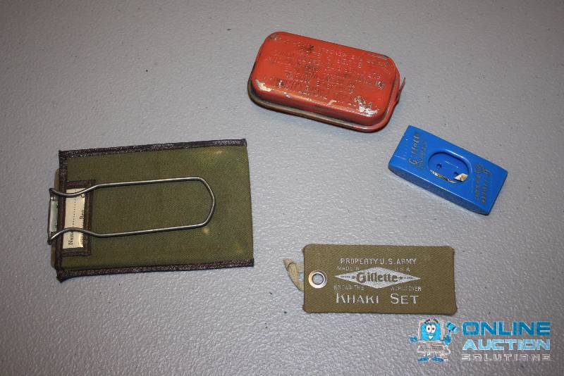 lot 198 image: U.S. Military First Aid Bandage Kit Including Razor Blade Case First Aid Packet And More.
