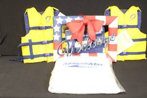 lot 17 image: Lot of 3 Overlook Adult Universal Life Vests and Patriotic Welcome Sign