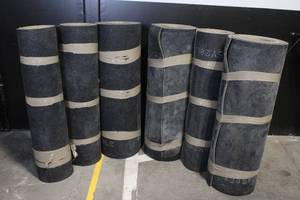 lot A-29 image: Lot of 7 Rolled Rubber Flooring Mats Approx. 48in Wide