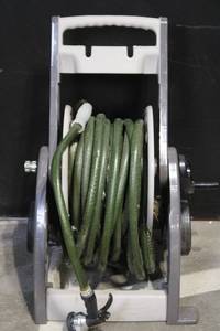 lot 35 image: Portable Garden Hose Reel Cart with Hose and Spray Nozzle