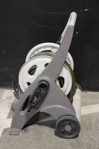 lot 49 image: Garden Hose Reel Cart with Hose and Adjustable Nozzle