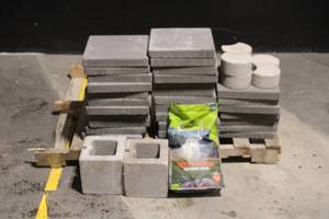 lot 83 image: Pallet Lot of Concrete Pavers, Cinder Blocks, and Deer Mineral Bag