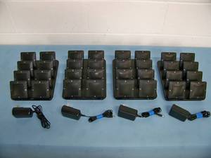 lot 70 image: (4) Revolabs Charging Bases with (32) Revolabs Mics  Microphones