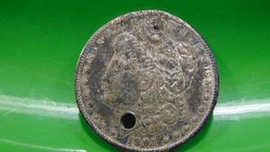lot 14 image: 1891 Morgan Silver Dollar, has a hole drilled in it