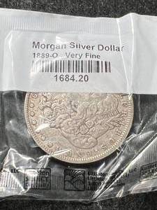 lot 14 image: 1889-O US MORGAN SILVER DOLLAR VF