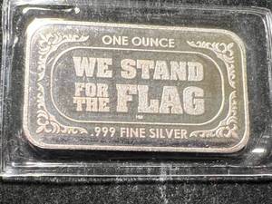 lot 21 image: 1 TROY OZ .999 FINE SILVER AMERICAN FLAG BAR IN COLOR