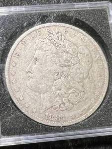 lot 32 image: 1881 US MORGAN SILVER DOLLAR IN CASE