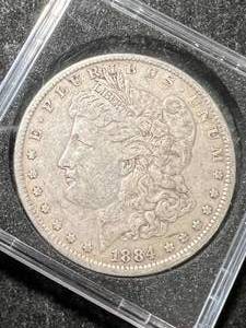 lot 39 image: 1884 US MORGAN SILVER DOLLAR IN CASE