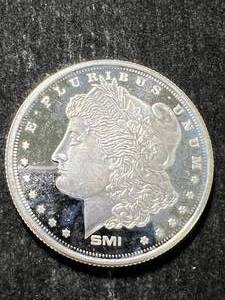 lot 67 image: 1 TROY OZ .999 FINE SILVER MORGAN DOLLAR DESIGNED ROUND