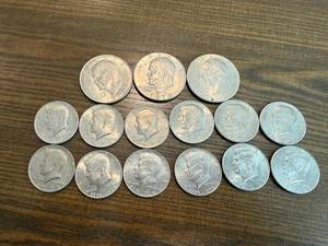 lot 32 image: 3 Ike Dollars & 12 Kennedy Half Dollars