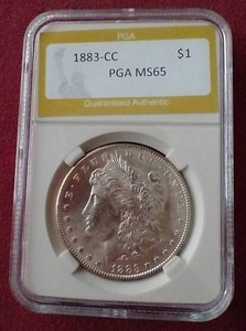 lot 72 image: Stunning 1883-CC Morgan Dollar - PGA MS65