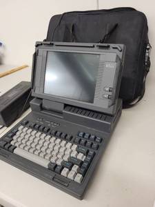 lot 9AE image: Vintage Dell 316LT Portable Laptop with Power Supply, Bag, and Cables
