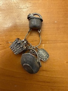 lot 12 image: Sterling Silver Brown Country Baskets Charms