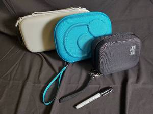 lot 44 image: Travel Case Set - Gray Rectangular Zip Case & Teal Round Zip Case & Black Square Zip Case