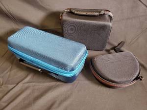 lot 66 image: Blue Shure Hard-Shell Case & Black Travel Case & Round Black Case