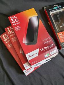 lot 72 image: ZAGG Glass Elite Screen Protectors for iPhone 15 Pro, Ghostek Covert 6 Case, and OtterBox Packaging Included