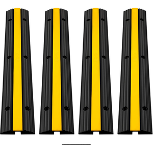 lot 105 image: VEVOR 4 Pack of 1-Channel Rubber Cable Protector Ramps Heavy Duty 22046Lbs Load Capacity Cable Wire Cord Cover Ramp Speed Bump Driveway Hose Cable Ramp Protective Cover (Used, Maybe Missing Hardware)