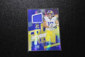 lot 94 image: 2023 Optic 1st Year Jersey Puka Nacua Relic Rookie Card