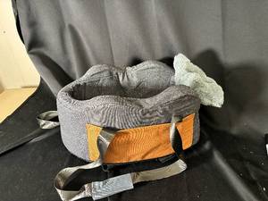 lot 88 image: Donut-shaped padded cushion - gray fabric & orange strap