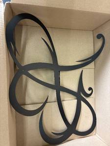 lot 93 image: Decorative metal wall sculpture - script flourish scrollwork