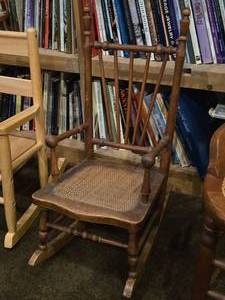 lot 715 image: Vintage Early American Farmhouse style Wooden Rocking Chair with Cane Seat