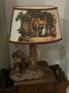 lot 757 image: Vintage 19 Lumberjack theme German Carved Wood Table Lamp with Lamp Shade featuring print of The Night Watch by Rembrandt