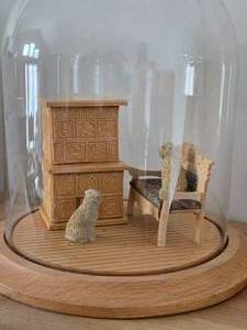 lot 821 image: Miniature Doll House Tile Stove Scale Replica with Dogs, Bench and Area Rug under Glass Dome