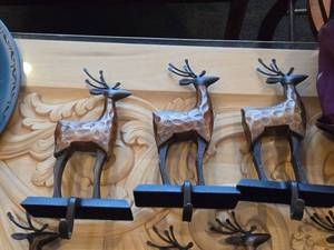 lot 842 image: Lot of (3) 8 Reindeer theme Rustic Wooden and Metal Christmas Stocking Holder Mantle Dcor