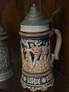 lot 872 image: Vintage 10 Ceramic German Beer Stein with Pewter Lid and relief image of Gambrinus
