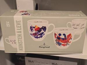 lot 1004 image: Coffee Mug Set (signed artwork design by Jan Vincents Johannessen) 2-pack - Kunsten A Leve by Porsgrund (in original packaging)
